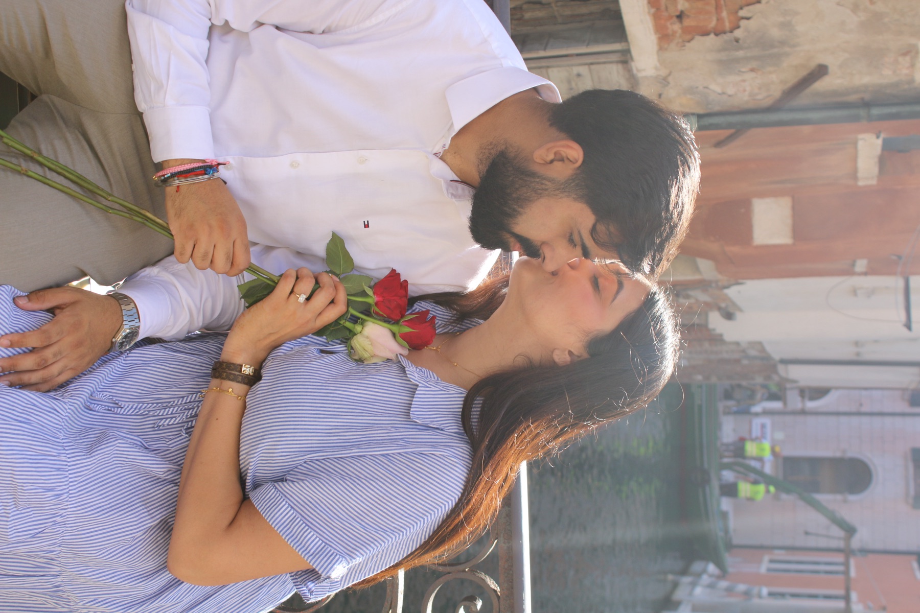 Milan and Gurleen sharing a kiss during a reunion